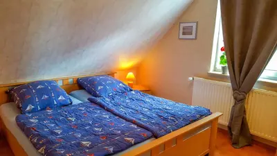 Ein Bett oder Betten in einem Zimmer der Unterkunft Ferienwohnung am Dorfrand