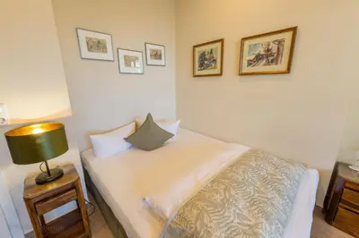 Ein Bett oder Betten in einem Zimmer der Unterkunft Gästehaus Bergfalke
