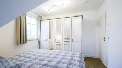 Ein Bett oder Betten in einem Zimmer der Unterkunft Sturmvogel 1 - Strandnahe Unterkunft in Zingst