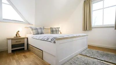 Ein Bett oder Betten in einem Zimmer der Unterkunft Sturmvogel 1 - Strandnahe Unterkunft in Zingst