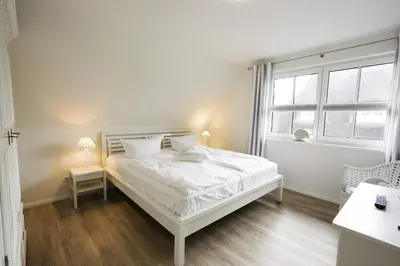 Ein Bett oder Betten in einem Zimmer der Unterkunft Haus Swanenhuus Natur & Meer erleben