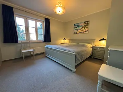 Ein Bett oder Betten in einem Zimmer der Unterkunft Boddenquartett - Boddenkieker