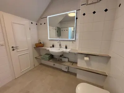 Ein Badezimmer in der Unterkunft Boddenquartett - Boddenkieker