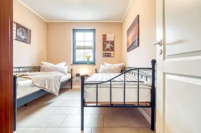 Ein Bett oder Betten in einem Zimmer der Unterkunft Villa Ostseestern Wohnung 