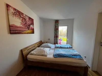 Ein Bett oder Betten in einem Zimmer der Unterkunft Dünengras