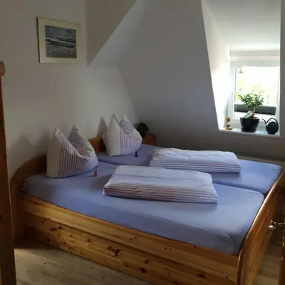 Ein Bett oder Betten in einem Zimmer der Unterkunft Barther Boddenblick