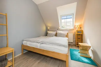 Ein Bett oder Betten in einem Zimmer der Unterkunft Störtebekerstrasse 10b Wohnung 3