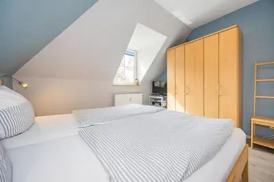 Ein Bett oder Betten in einem Zimmer der Unterkunft Störtebekerstrasse 10b Wohnung 3