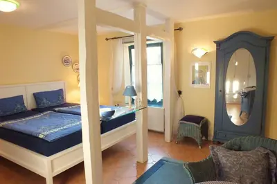 Ein Bett oder Betten in einem Zimmer der Unterkunft Ferienwohnungen im Klönhus