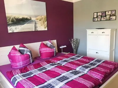 Ein Bett oder Betten in einem Zimmer der Unterkunft Ferienwohnung Heimathafen