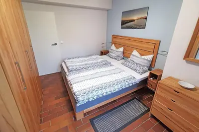 Ein Bett oder Betten in einem Zimmer der Unterkunft Ferienwohnung Sonnenstrahl