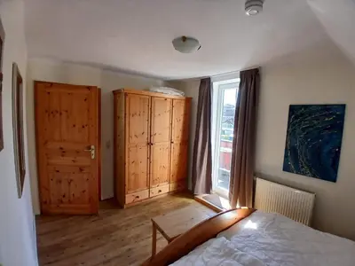 Ein Bett oder Betten in einem Zimmer der Unterkunft Ferienwohnung Landhaus Ostseebrise OG