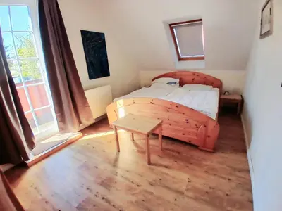 Ein Bett oder Betten in einem Zimmer der Unterkunft Ferienwohnung Landhaus Ostseebrise OG