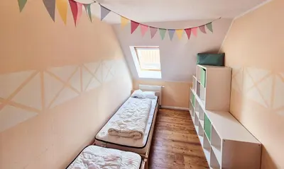 Ein Bett oder Betten in einem Zimmer der Unterkunft Ferienwohnung Landhaus Ostseebrise OG
