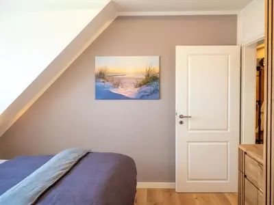 Ein Bett oder Betten in einem Zimmer der Unterkunft Dünenbrise
