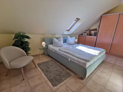 Ein Bett oder Betten in einem Zimmer der Unterkunft UNSERE PERLE IM ZENTRUM von Zingst MIT SÜDTERRASSE