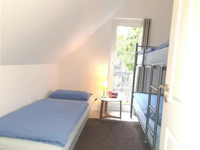 Ein Bett oder Betten in einem Zimmer der Unterkunft Börlingstrasse 15a
