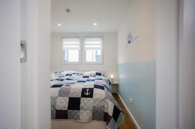 Ein Bett oder Betten in einem Zimmer der Unterkunft Tiny Haus Boddenblick