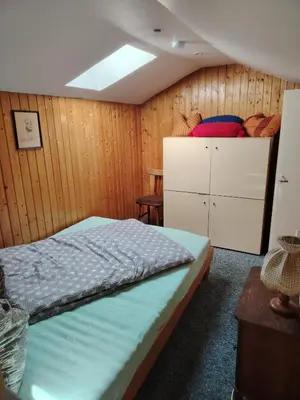 Ein Bett oder Betten in einem Zimmer der Unterkunft Ferienhaus Waldblick