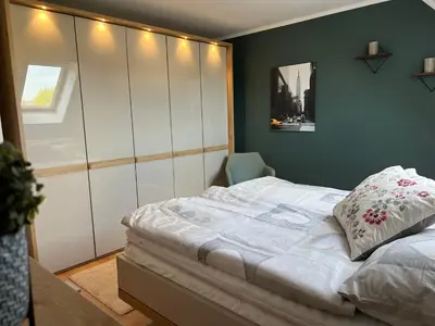 Ein Bett oder Betten in einem Zimmer der Unterkunft Kranichblick