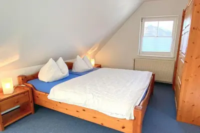 Ein Bett oder Betten in einem Zimmer der Unterkunft Zimmer 4