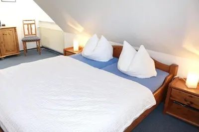 Ein Bett oder Betten in einem Zimmer der Unterkunft Zimmer 4
