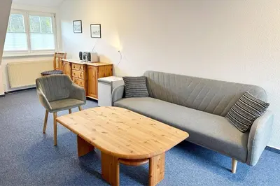 Ein Sitzbereich in der Unterkunft Zimmer 4