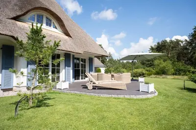 Ein Garten an der Unterkunft Ferienhaus Haubenlerche 15