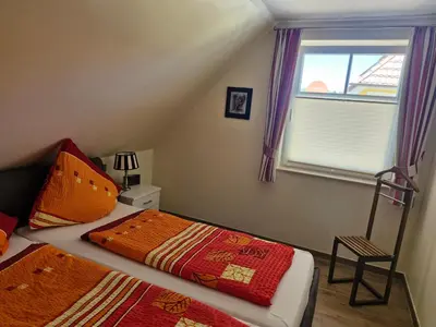 Ein Bett oder Betten in einem Zimmer der Unterkunft STRANDROSE - 300m zum Strand