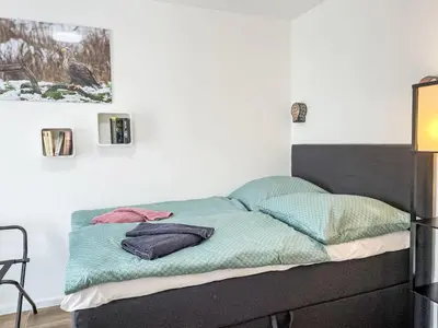 Ein Bett oder Betten in einem Zimmer der Unterkunft Holiday Home Der kleine Kranich by Interhome