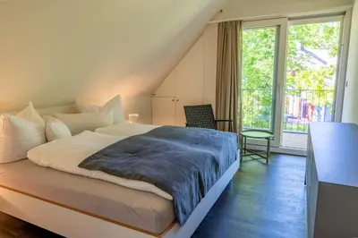 Ein Bett oder Betten in einem Zimmer der Unterkunft Ostseedomizil 