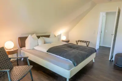 Ein Bett oder Betten in einem Zimmer der Unterkunft Ostseedomizil 