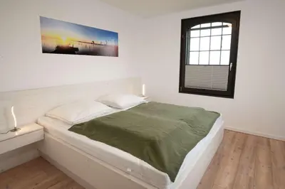 Ein Bett oder Betten in einem Zimmer der Unterkunft Exklusive Ferienwohnung Sonnensicht in Barth