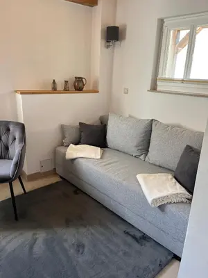 Ein Sitzbereich in der Unterkunft Gartenhaus