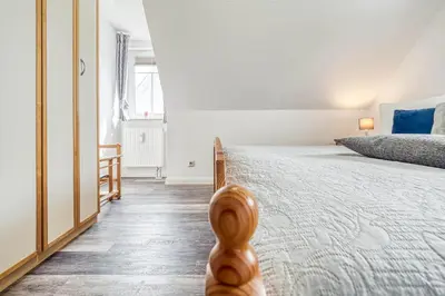 Ein Bett oder Betten in einem Zimmer der Unterkunft Hafenstraße 22a Sonnenseite