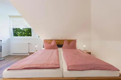 Ein Bett oder Betten in einem Zimmer der Unterkunft Ferienwohnung Strand