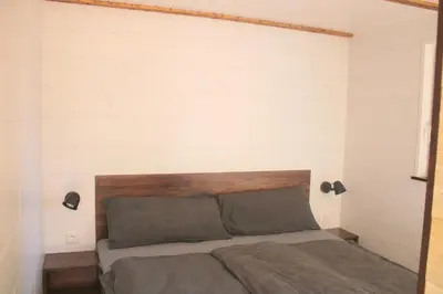 Ein Bett oder Betten in einem Zimmer der Unterkunft Ostsee Tiny Haus Wachtel