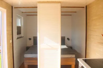 Ein Bett oder Betten in einem Zimmer der Unterkunft Ostsee Tiny Haus Meise
