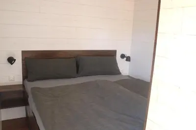 Ein Bett oder Betten in einem Zimmer der Unterkunft Ostsee Tiny Haus Meise