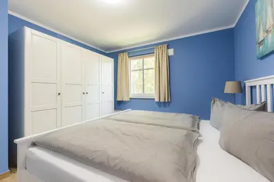 Ein Bett oder Betten in einem Zimmer der Unterkunft HMuschelsucher, Birkenstraße 7a, App 4