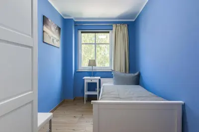 Ein Bett oder Betten in einem Zimmer der Unterkunft HMuschelsucher, Birkenstraße 7a, App 4