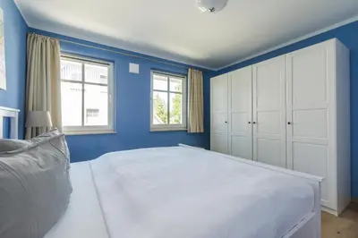 Ein Bett oder Betten in einem Zimmer der Unterkunft HMuschelsucher, Birkenstraße 7a, App 6