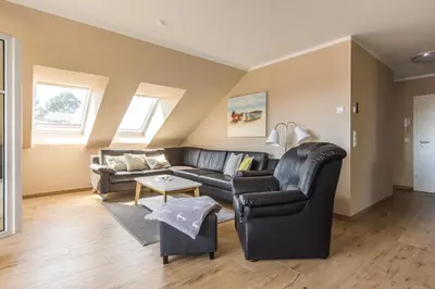 Ein Sitzbereich in der Unterkunft HMuschelsucher, Birkenstraße 7a, App 7
