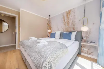 Ein Bett oder Betten in einem Zimmer der Unterkunft Strandvilla Zingst -AP 14