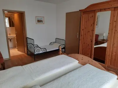 Ein Bett oder Betten in einem Zimmer der Unterkunft Zwischen Meer und Bodden App 03