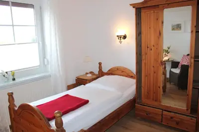 Ein Bett oder Betten in einem Zimmer der Unterkunft Zwischen Meer und Bodden App 05