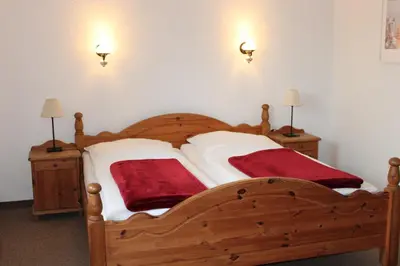 Ein Bett oder Betten in einem Zimmer der Unterkunft Zwischen Meer und Bodden App 01