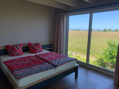 Ein Bett oder Betten in einem Zimmer der Unterkunft Panorama-Haus Boddenperle