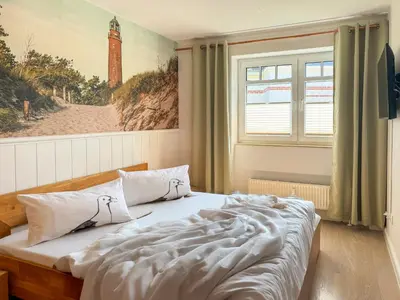 Ein Bett oder Betten in einem Zimmer der Unterkunft Lütte Auszeit