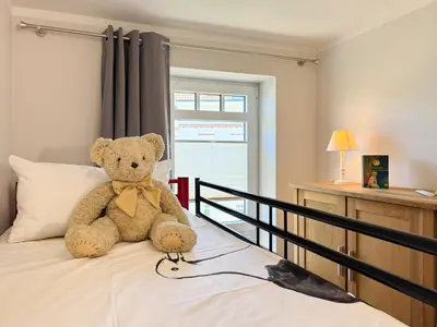 Ein Bett oder Betten in einem Zimmer der Unterkunft Lütte Auszeit
